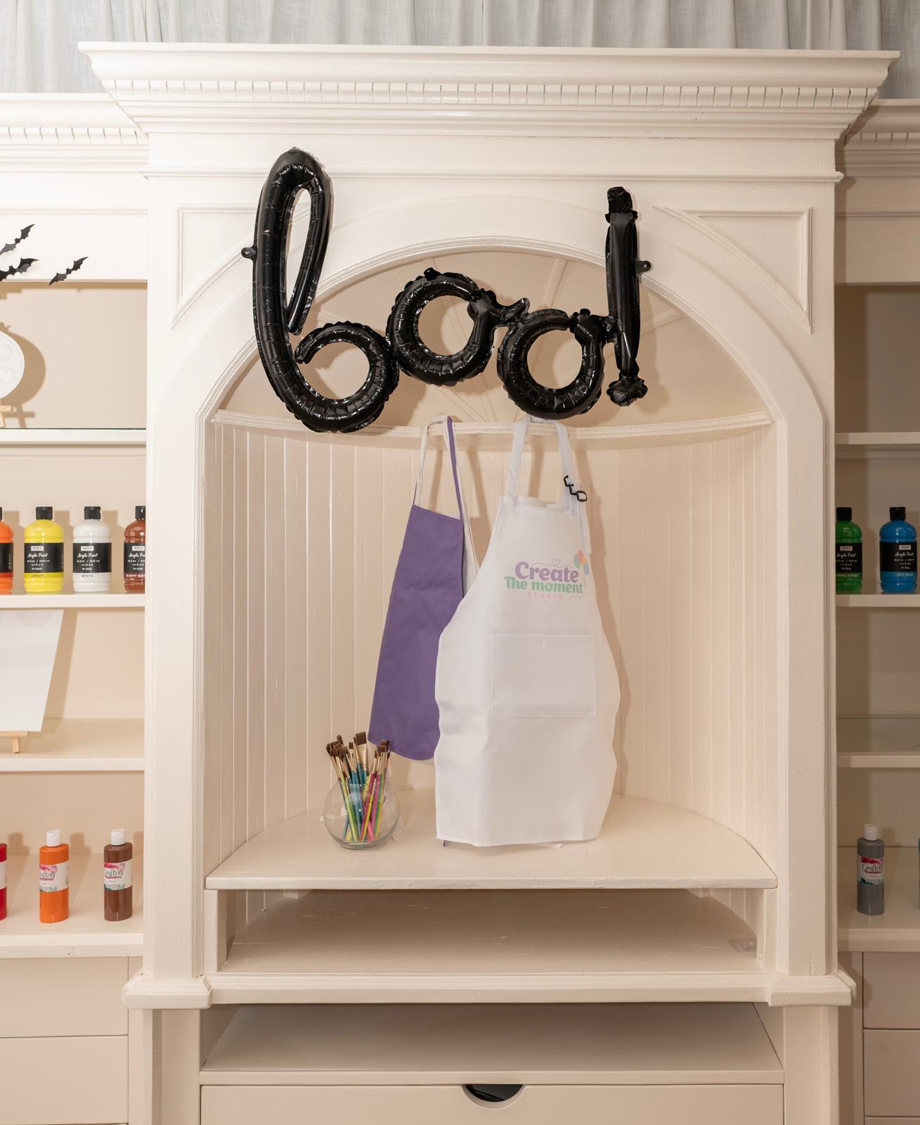 Aprons and paints ready for a creative workshop