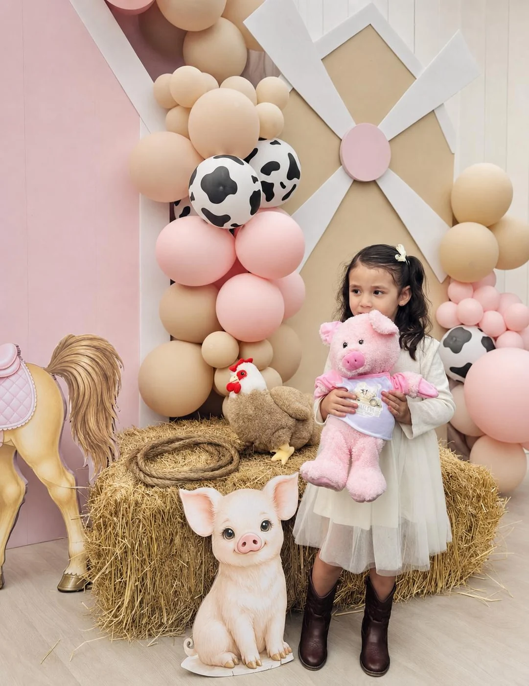 Young guest holding her plush friend at a farm-themed party