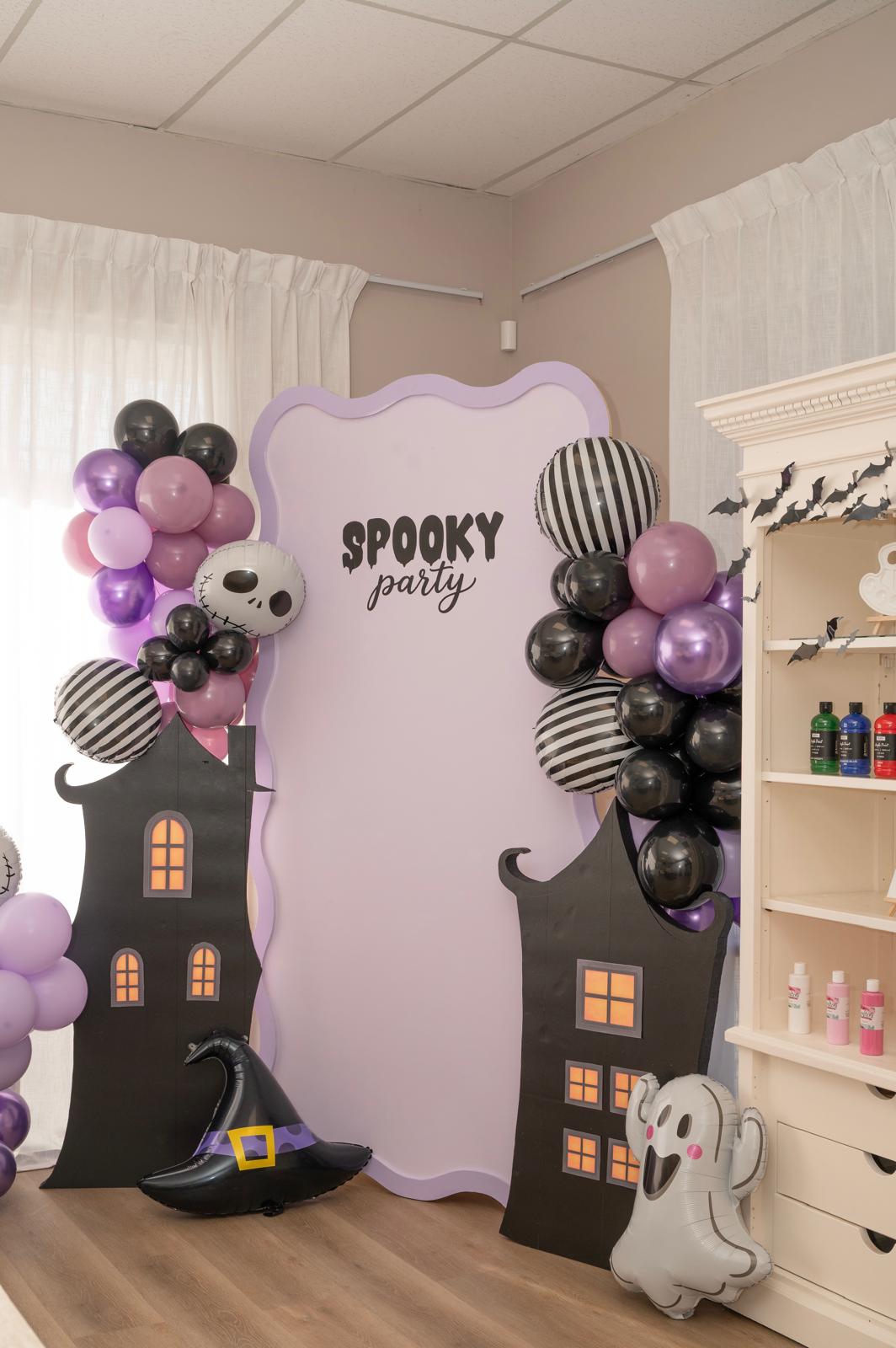 Themed party backdrop set up inside the studio