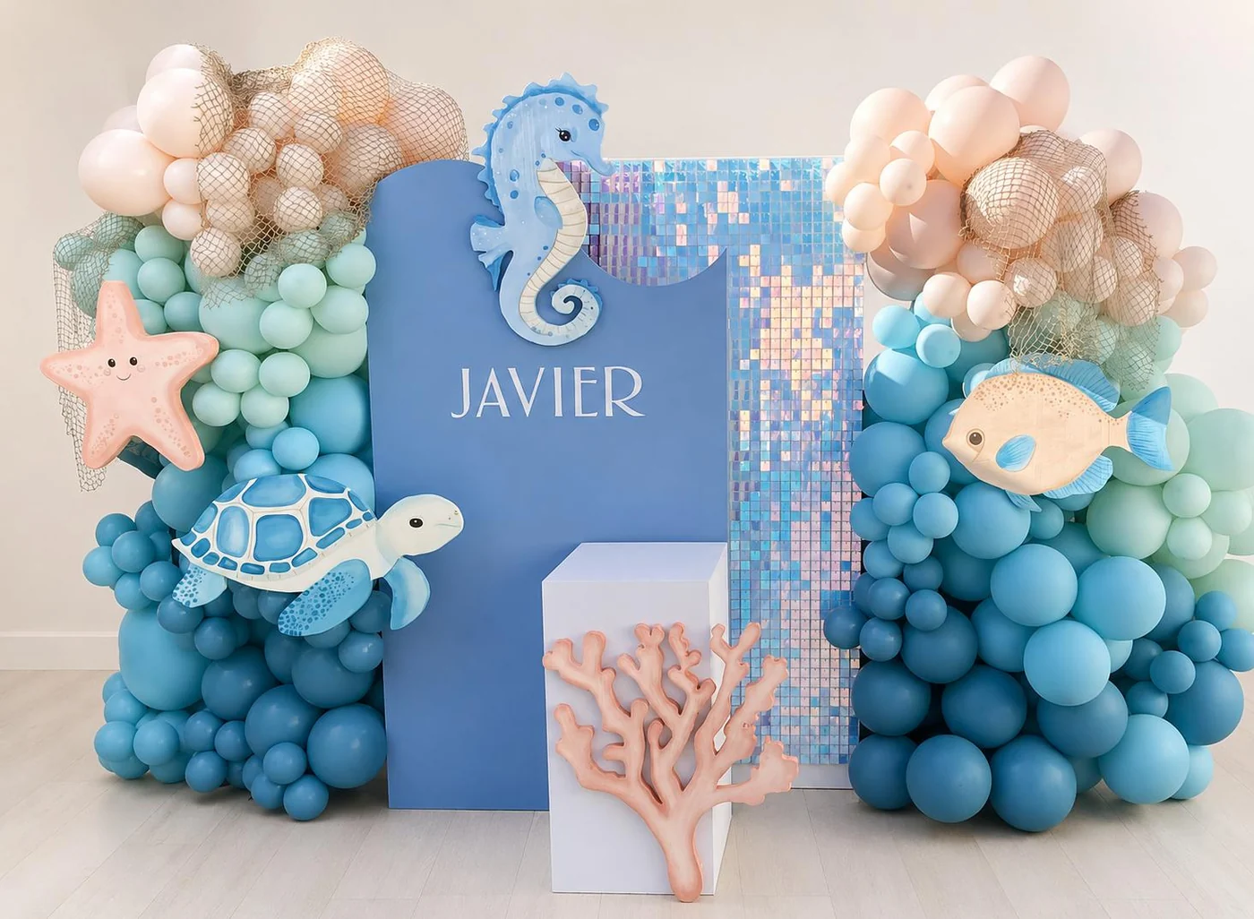 Under-the-sea birthday backdrop with pastel balloon decorations